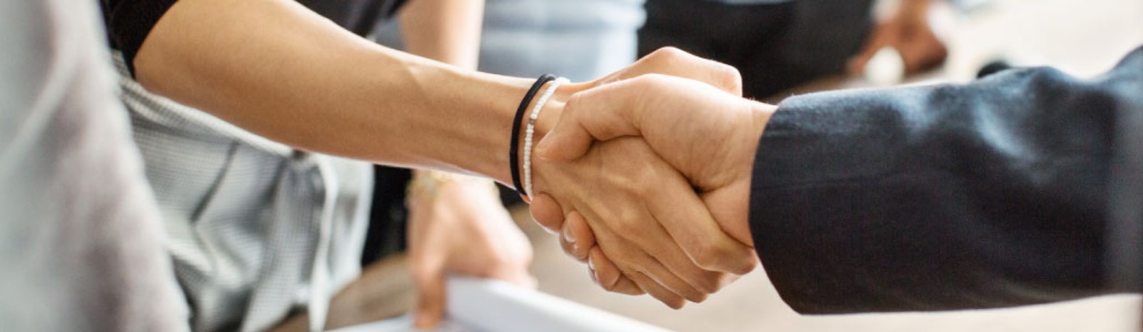 two people shaking hands 