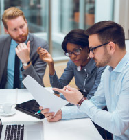 Three people at a business meeting