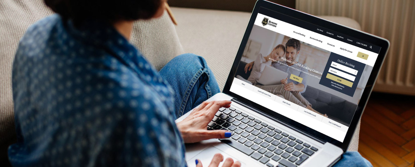Woman on a computer looking at Greenville website