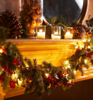 Fireplace mantle with Christmas Garland and Decorations