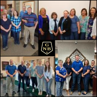 Group of employees all wearing blue