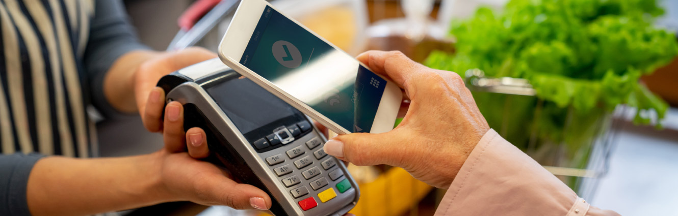 person paying with smartphone