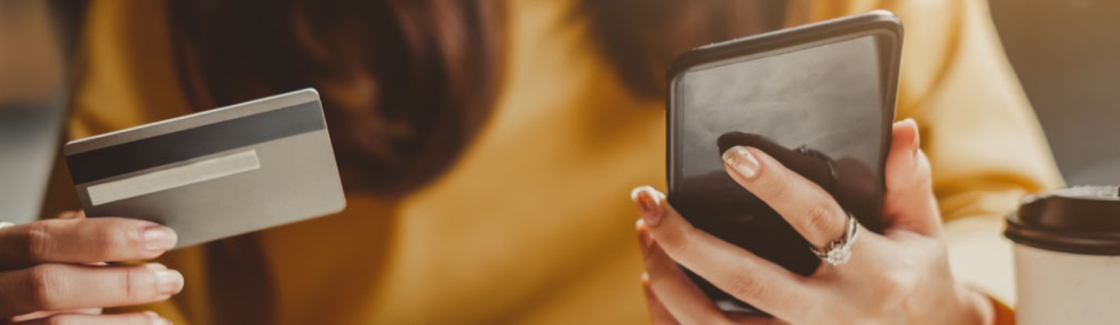 someone using credit card on phone