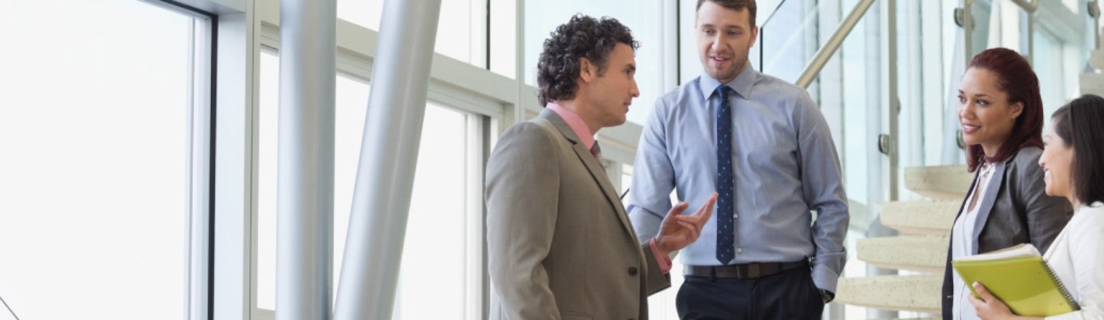 Team talking in office.